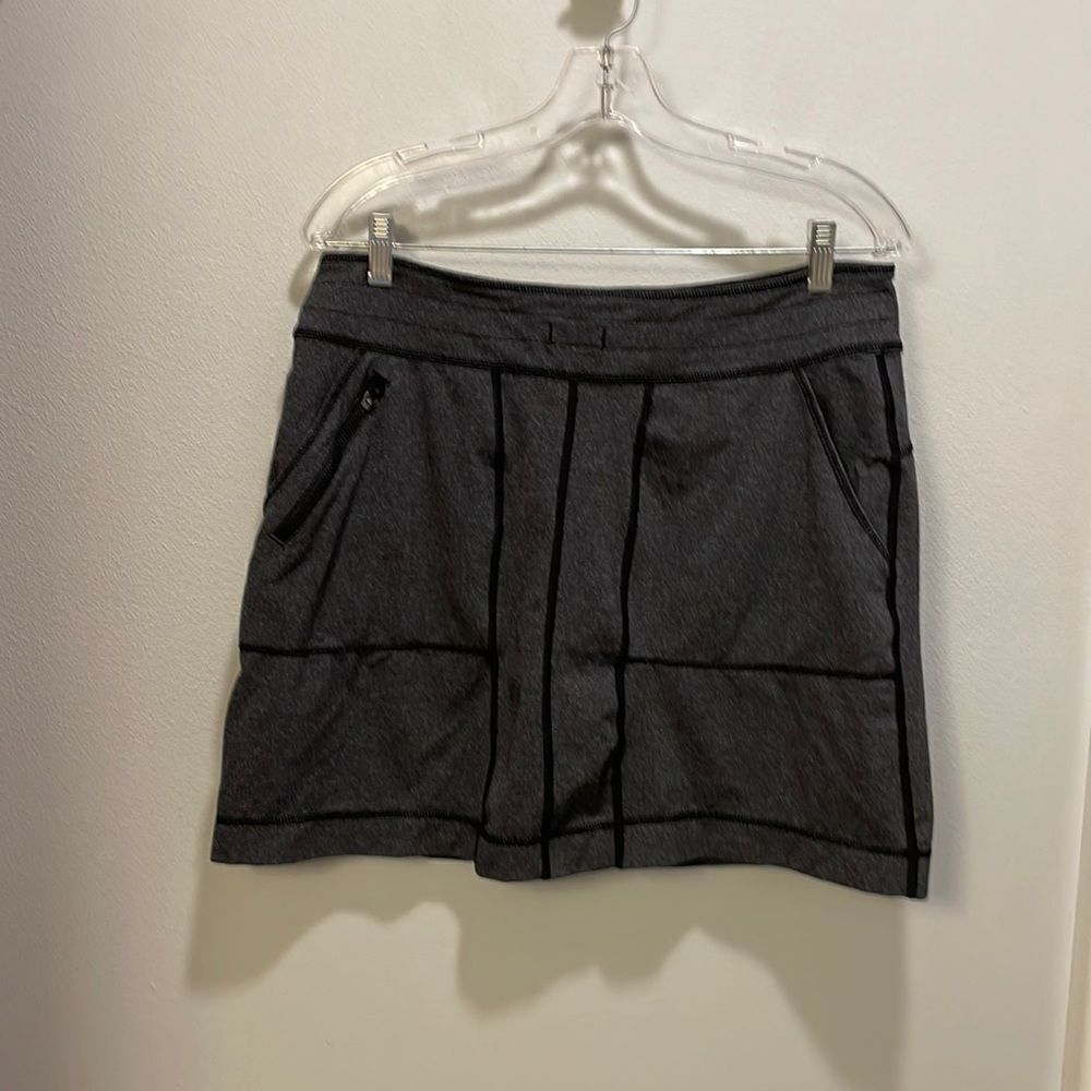 TITLE Nine woman’s grey and black tennis skirt